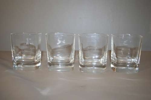 A GORGEOUS SET OF FOUR WHISKEY GLASSES WITH THICK HEAVY BASES IN GREAT CONDITION!!